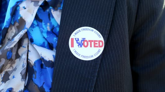 A voter wears an, 'I Voted', sticker after casting her ballot at The Coliseum where a polling station is setup on November 4, 2014 in St Petersburg, Florida.