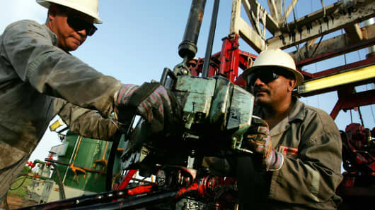 Oil workers conduct a drill in a petroleum well in Lagunillas at the east coast of Lake Maracaibo near Maracaibo City in Venezuela.