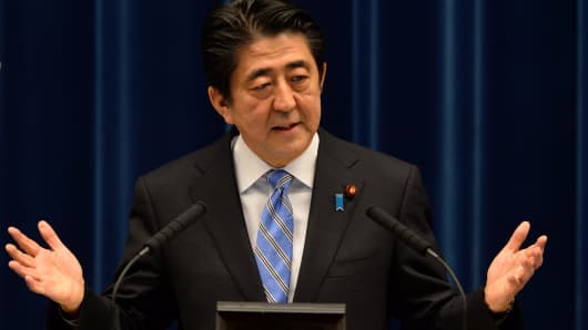 Shinzo Abe, Japan's prime minister, gestures as he speaks during a news conference at the prime minister's official residence in Tokyo, Japan, on Tuesday, Nov. 18, 2014.