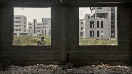 Abandoned buildings are shown at the Caofeidian Environmental Industries Park in Caofeidian, China.