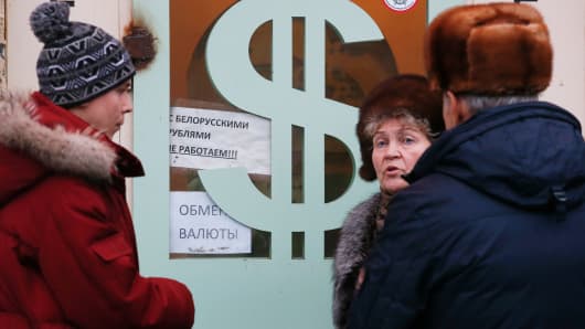 People gather near a currency exchange office in Moscow, Dec. 17, 2014.