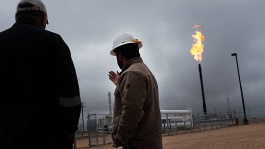 Flared natural gas is burned at an Apache natural gas plant in the Permian Basin in Garden City, Texas.