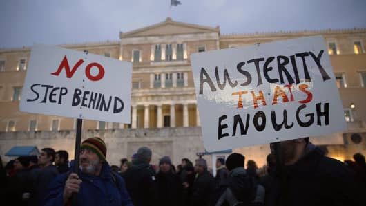 Protesters take part in an anti-austerity pro-government demonstration in front of the parliament in Athens February 11, 2015.
