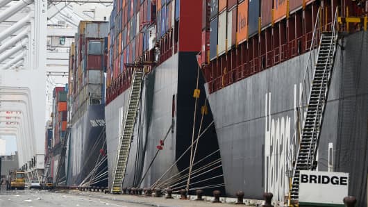 Container ships sit docked in a berth at the Port of Oakland on Feb. 17, 2015.