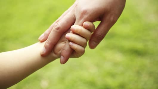 Parent child holding hands