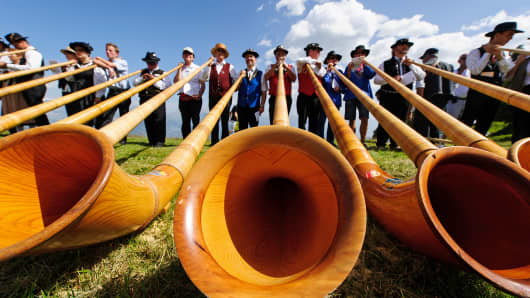Alphorn players perform in Nendaz, Switzerland.