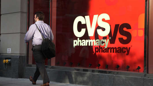 A pedestrian passes a CVS store in New York.