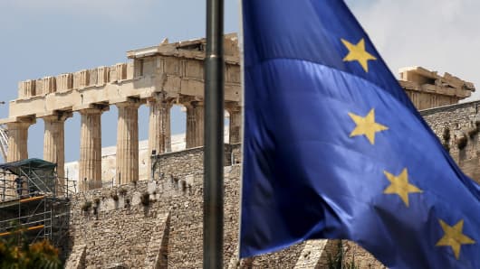 A European Union flag flutters before the temple of Parthenon at the Acropolis hill in Athens, Greece June 26, 2015.