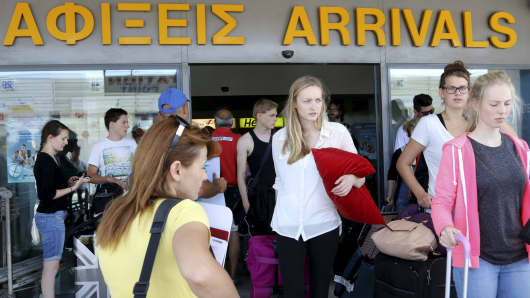 Tourists arrive at the airport on the island of Crete, Greece, July 6, 2015.