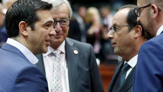 (L-R) Greece's Prime Minister Alexis Tsipras, European Commission President Jean-Claude Juncker, France's President Francois Hollande and Belgium's Prime Minister Charles Michel attend an euro zone leaders summit in Brussels, Belgium, July 12, 2015.