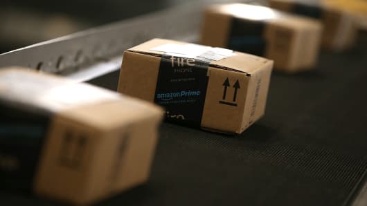 Boxes move along a conveyor belt at an Amazon fulfillment center in Tracy, California.