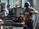 A worker repairs steam locomotive parts in Fuxin coal mine locomotive repair plant in Fuxin, China.