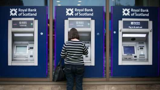 ATM cash machines outside a branch of the Royal Bank of Scotland in Edinburgh.