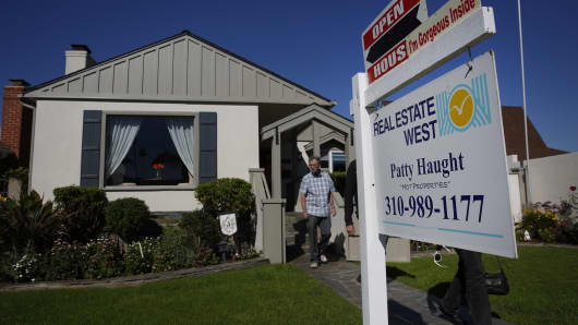 Potential homebuyers exit an open house in Redondo Beach, California.