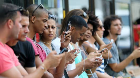 Cubans using their mobile devices in Havana, Cuba.
