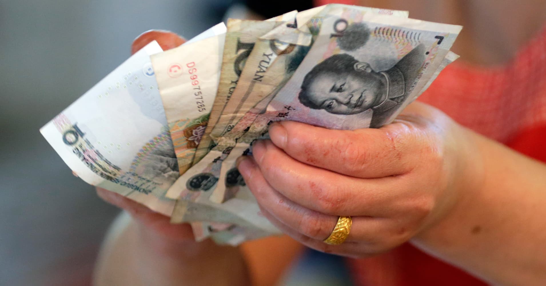 What China's yuan move means for emerging markets-—commentary