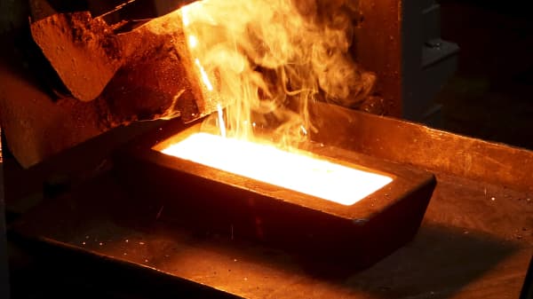 A melter casts an ingot of 92.96 percent pure gold at a procession plant of the Olimpiada gold operation, owned by Polyus Gold International company, in Krasnoyarsk region, Eastern Siberia, Russia.