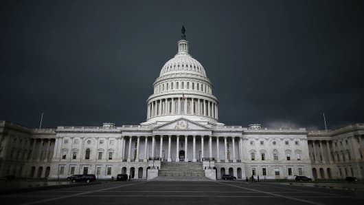 Storm clouds fill the sky over the U.S. Capitol Building in Washington, DC.