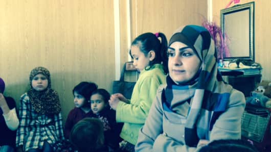 Asma'a Rashed in the trailer where she reads to kids each week at the Za'atari refugee camp in Northern Jordan