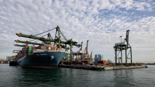 A container vessel docks at the Tanjong Pagar Terminal in Singapore.