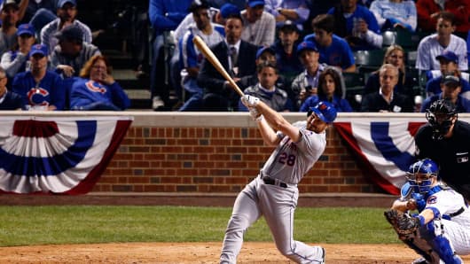 The Mets' Daniel Murphy hits a two run homer against the Cubs during Game 4 of the 2015 National League Championship Series at Wrigley Field, on Oct. 21, 2015.
