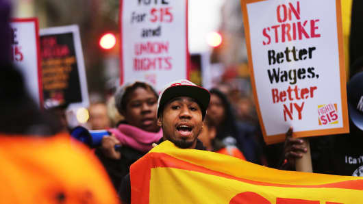 Low wage workers and supporters protest for a $15 an hour minimum wage on November 10, 2015 in New York.
