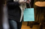 A woman carries a Tiffany & Co. shopping bag in New York.