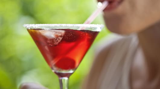 Woman sipping cocktail