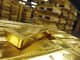 Gold Bullion stacked in a safehouse.