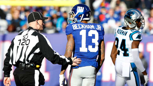 Odell Beckham of the New York Giants talks with a referee after a play with Josh Norman of the Carolina Panthers during their game at MetLife Stadium on Dec. 20, 2015, in East Rutherford, New Jersey.