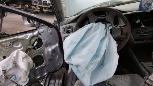 A deployed airbag is seen in a 2001 Honda Accord at the LKQ Pick Your Part salvage yard on May 22, 2015 in Medley, Florida. The largest automotive recall in history centers around the defective Takata Corp. air bags that are found in millions of vehicles that are manufactured by BMW, Chrysler, Daimler Trucks, Ford, General Motors, Honda, Mazda, Mitsubishi, Nissan, Subaru and Toyota. (