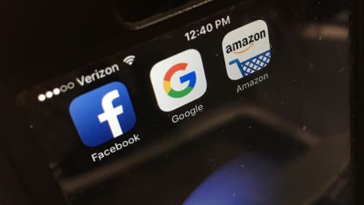 Facebook, Google and Amazon apps displayed on a smartphone.