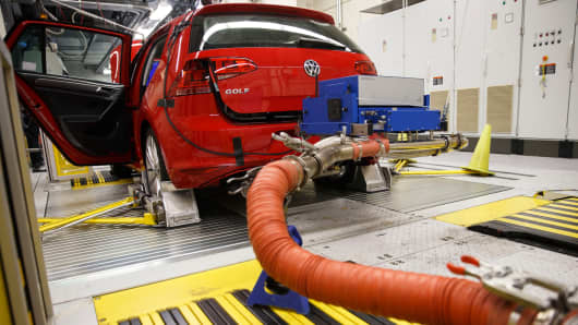Hoses connect laboratory emission testing equipment to a red 2016 Volkswagen AG Golf TDI inside the California Air Resources Board Haagen-Smit Laboratory in El Monte, California.