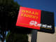 A sign is displayed outside of a Wells Fargo bank in San Francisco, California.