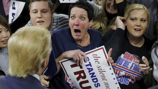 Audience member Robin Roy (C) reacts as U.S. Republican presidential candidate Donald Trump greets her at a campaign rally in Lowell, Massachusetts January 4, 2016.