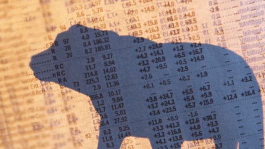 Stock quotes and silhouette of a bear
