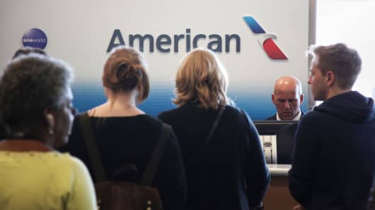Passengers at an American Airlines gate at the Dallas/Fort Worth International airport in Dallas.