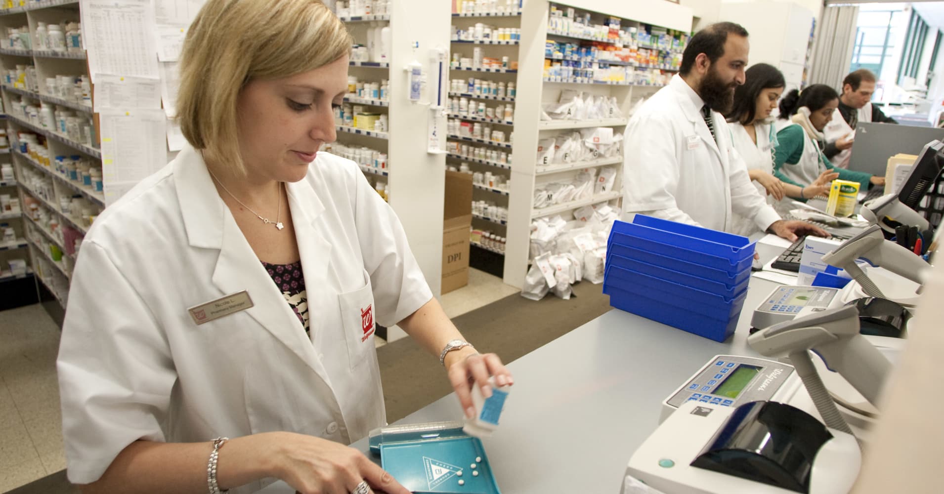Pharmacy manager prepares a prescription at a Walgreens store.