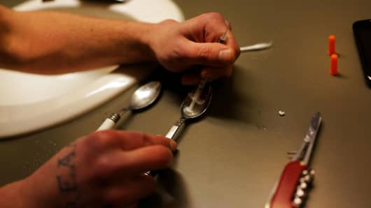 Drugs are prepared to shoot intravenously by a user addicted to heroin in St. Johnsbury Vermont. (File photo).