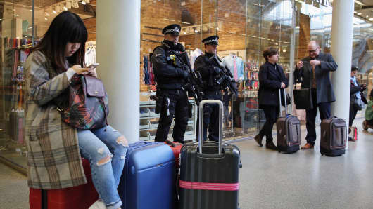 Armed Police Officers stand at the entrance to the Eurostar at St Pancras Station on March 22, 2016 in London, England.
