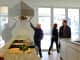 Prospective buyers with their real estate agent survey the kitchen of a new home in Denver, Co.