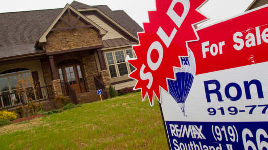 A sold sticker is displayed on a for sale sign outside a home in Garner, North Carolina.