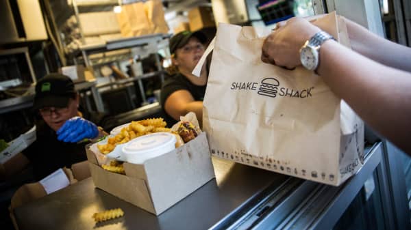 Customers pick up their orders from Shake Shack.