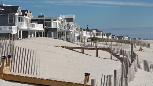 Ocean front homes stand along the beach on Long Beach Island in Long Beach Township, New Jersey.