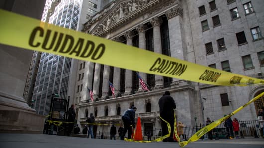 Yellow "Caution" tape is displayed outside of the New York Stock Exchange.