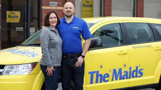Deanna and John Hanson, owner of The Maids. Deanna is an officer of their franchise corporation.