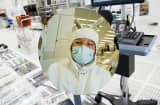 A technician inspects a silicon wafer at the Applied Materials Maydan Technology Center in Santa Clara, California.