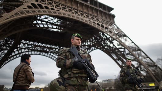 French troops patrol around the Eifel Tower on January 12, 2015 in Paris, France.