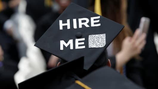 A graduating student of the City College of New York wears a message on his cap during the College's commencement ceremony in the Harlem section of Manhattan.