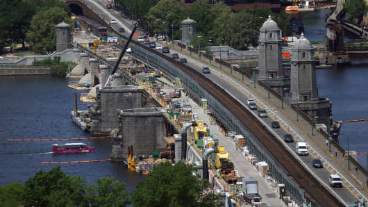 Repairs on the Longfellow Bridge continue, including the removal of a couple of salt and pepper shaker-like towers.